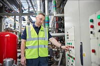 Technician conducting routine maintenance as part of a planned preventative maintenance schedule.